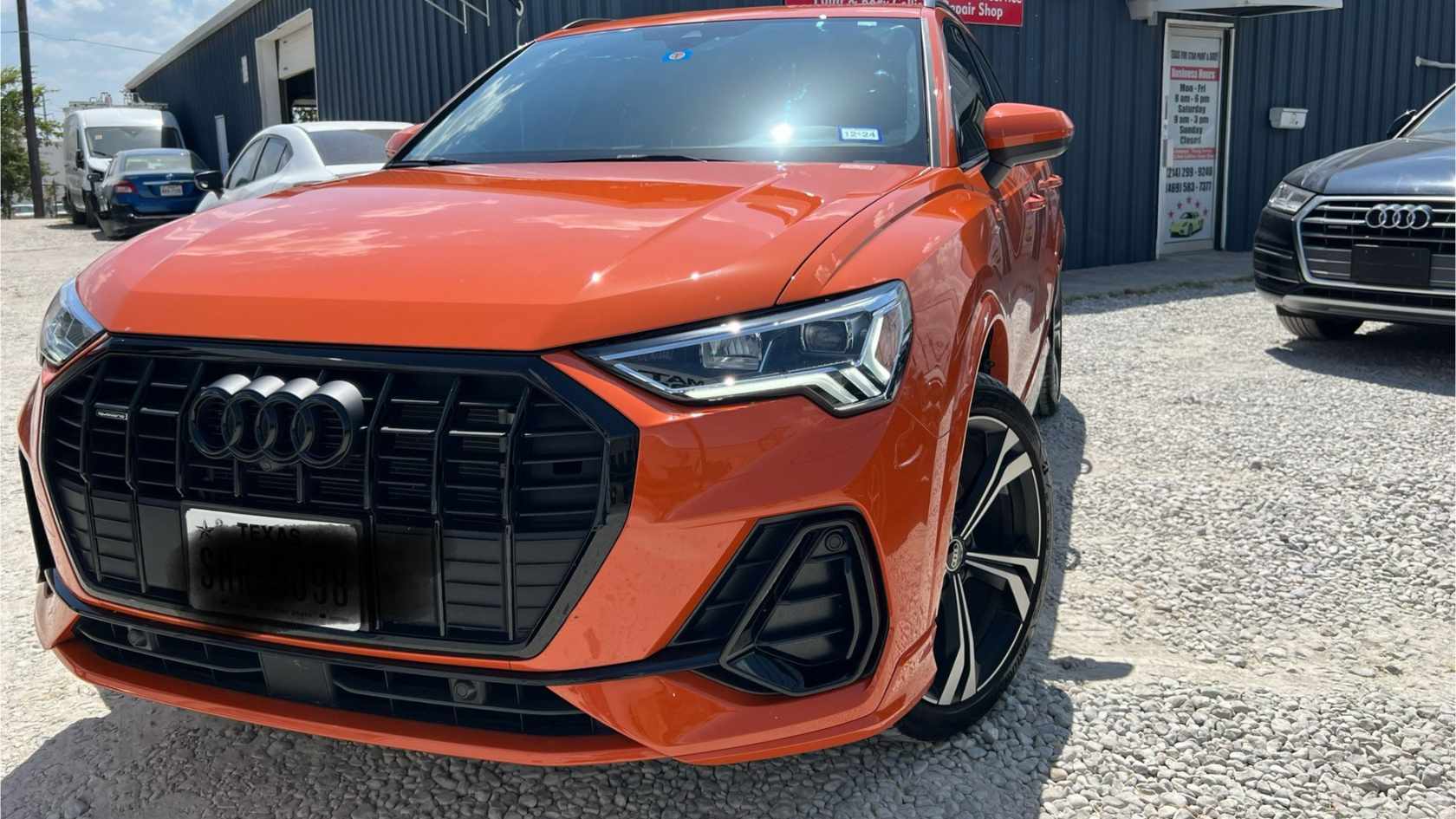 Showroom-quality finish on a black SUV after paint correction.