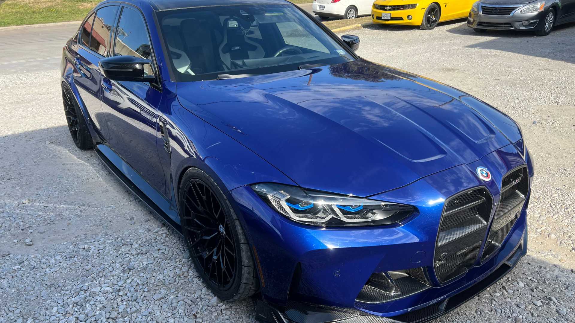 A vehicle with a new set of custom wheels and paint.