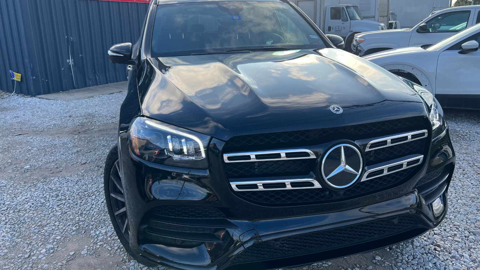 Expert repair on a white SUV after a side collision.