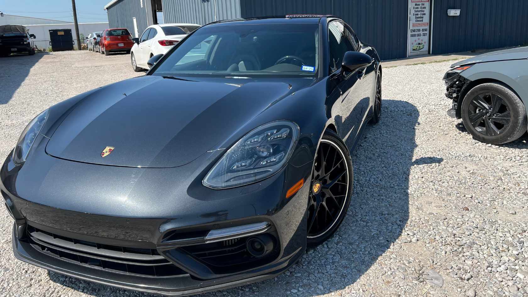 A modern sports car undergoing paint correction and polishing.