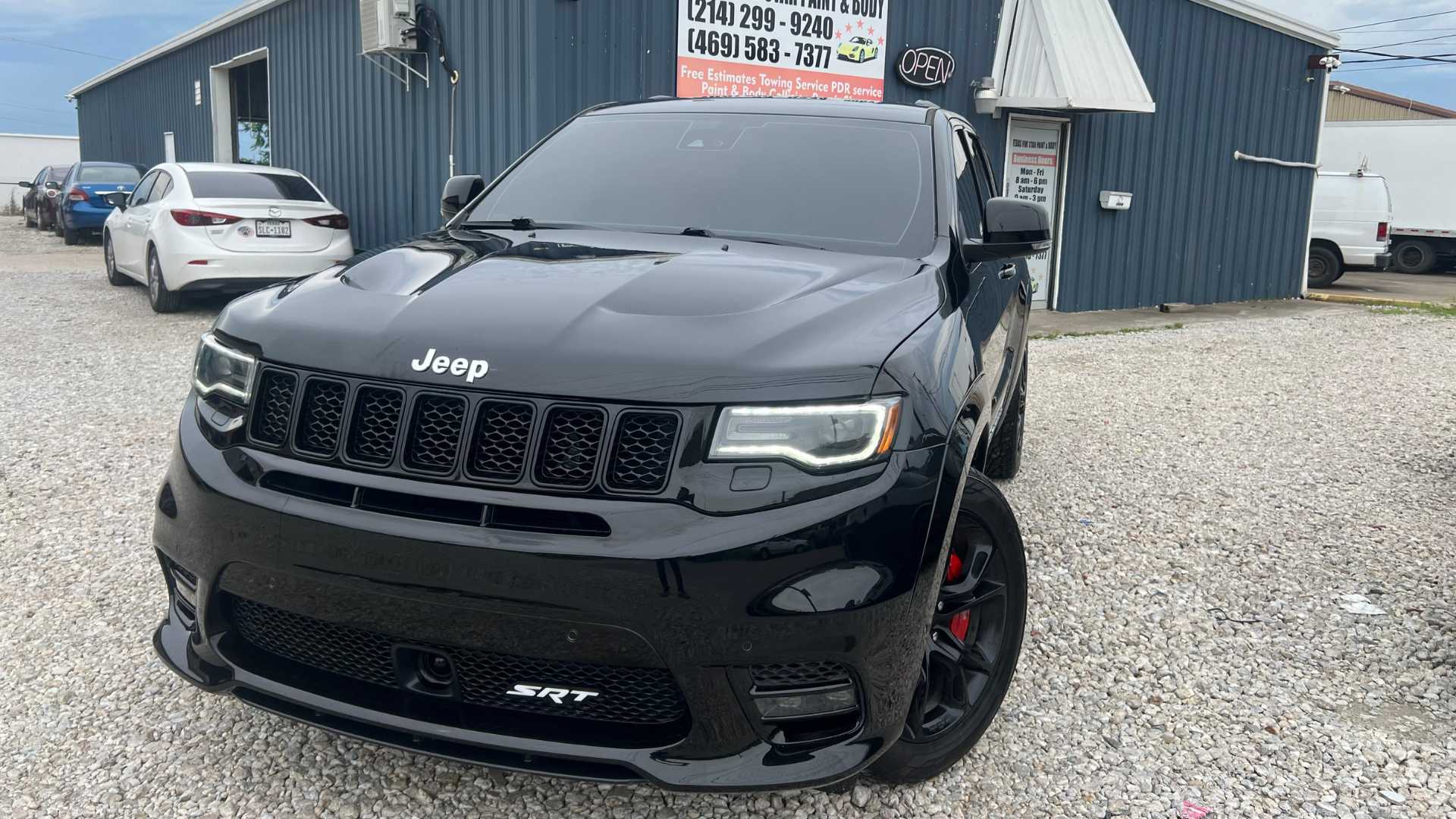 Dodge Challenger with a vibrant custom orange paint job.