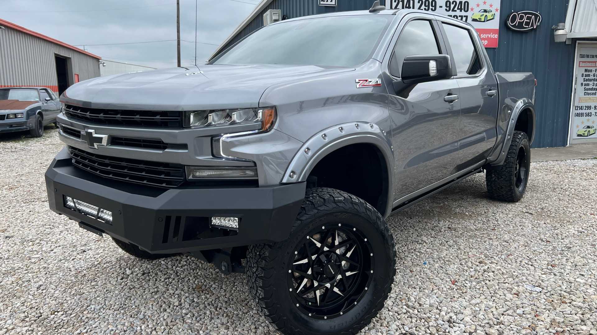 A red Ford Mustang with a high-gloss finish after paint correction service.